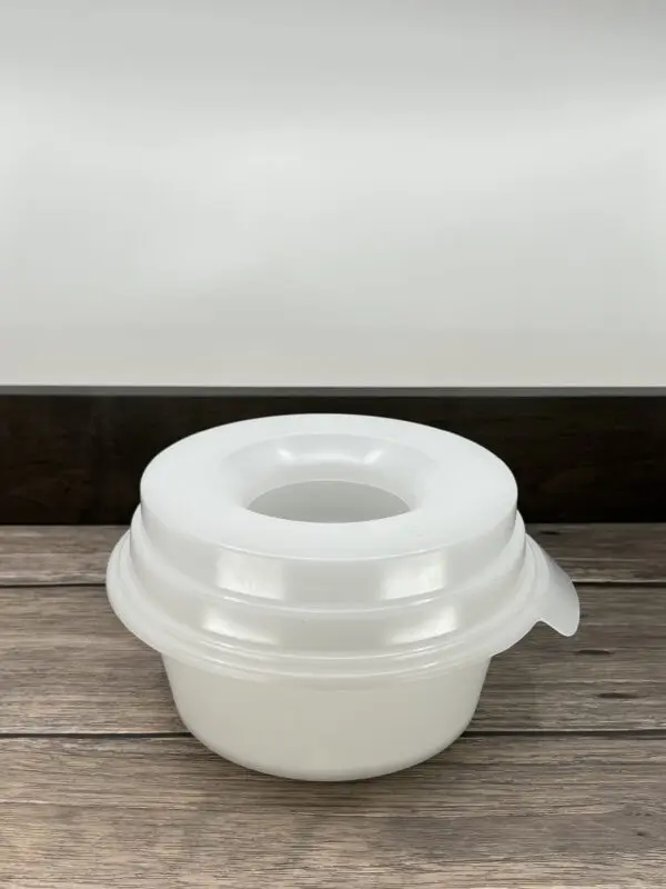White Color Bowl for Pets on a Wooden Surface