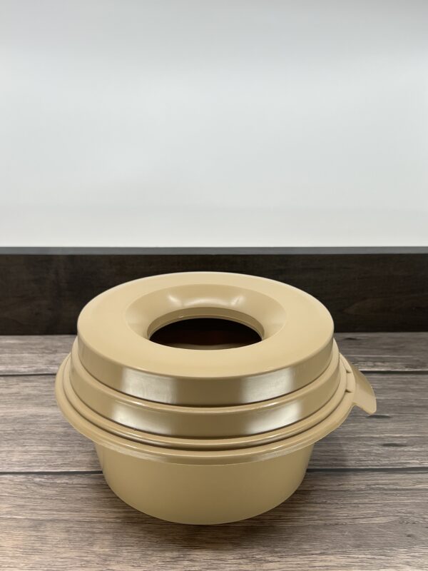 A Gold Color Pet Bowl for Pets on a SUrface